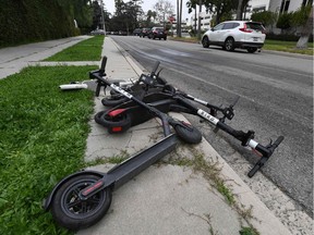 Cities across the U.S. are grappling with the growing trend of electric scooters that users can unlock with a smartphone app. Scooter startups, including Bird and Lime, allow riders to park them anywhere that doesn't block pedestrian walkways, but residents in some cities, including Los Angeles, say they often litter sidewalks and can pose a danger to pedestrians.