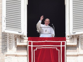 Pope Francis waves from the window of the apostolic palace overlooking St. Peter's square during the weekly Angelus prayer on September 1, 2019 at the Vatican.