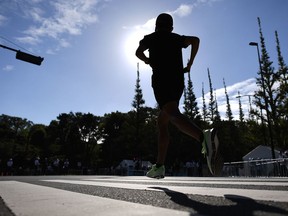 An athlete warms up before the start of the Marathon Grand Championship, which is also the marathon test event for the upcoming Tokyo 2020 Olympic Games