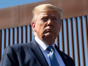 U.S. President Donald Trump visits the US-Mexico border fence in Otay Mesa, California on September 18, 2019.