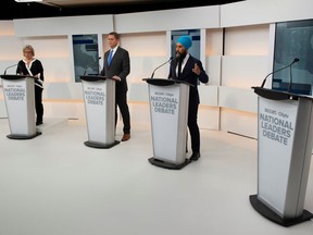 Green Party leader Elizabeth May, Conservative leader Andrew Scheer and New Democratic Party (NDP) leader Jagmeet Singh take part in the Maclean's/Citytv National Leaders Debate alongside an empty place due to the non appearance of Prime Minister Justin Trudeau.