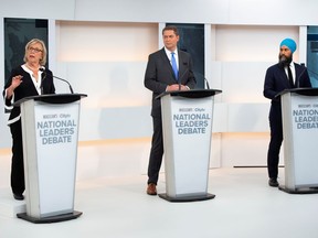 Green party Leader Elizabeth May, Conservative Leader Andrew Scheer and New Democratic Party (NDP) Leader Jagmeet Singh take part in the Maclean's/Citytv National Leaders Debate in Toronto, Ontario, Canada September 12, 2019. May's suggestion that Quebec be left alone over Bill 21 inspired a column by Richard Martineau, Lise Ravary writes.