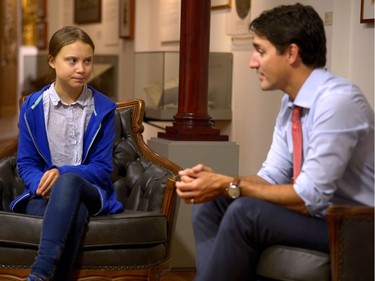 Canada's Prime Minister Justin Trudeau greets Swedish climate change teen activist Greta Thunberg before a climate strike march in Montreal, Quebec, Canada September 27, 2019.