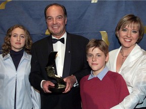 Journalist Pierre Nadeau was surrounded by his daughter Pascale and grandchildren Alexandra and Julien after receiving 
a Gémeaux prize from the Canadian Academy of Television and Cinema in 2001.