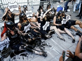 Activists from PETA stage a demonstration outside a venue during London Fashion Week in London, Britain, September 13, 2019.