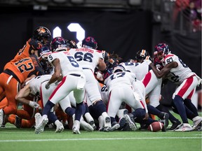 Montreal Alouettes quarterback Antonio Pipkin (17) fumbles the ball, which was picked up by Eugene Lewis (87), who was stopped by the B.C. Lions on the goal line on a third and goal, during the second half of a CFL football game in Vancouver, on Saturday September 28, 2019.