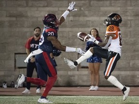 Alouettes linebacker Boseko Lokombo breaks up a pass intended for B.C. Lions wide-receiver Shaq Johnson during fourth quarter CFL football action in Montreal on Friday, Sept. 6, 2019.