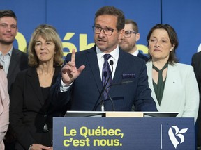 Bloc Québécois Leader Yves-François Blanchet responds to reporters' questions at a news conference to comment on the launch of his party's federal election campaign. Local Bloc candidates Christian Hébert, from the left, Christiane Gagnon, leader Yves-François Blanchet, Sébastien Bouchard-Théberge and Julie Vignola look on.