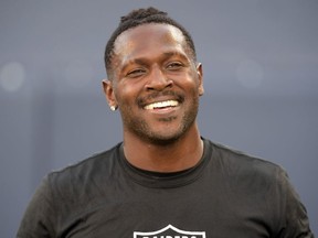 Oakland Raiders wide receiver Antonio Brown reacts before a game against the Green Bay Packers at Investors Group Field.