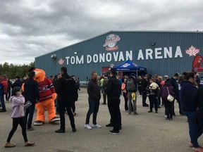 Hockey fans gather outside the Tom Donovan Arena in Renous, N.B., Tuesday, Sept. 17, 2019. The tiny New Brunswick community, known mainly for its federal maximum-security prison, has been transformed into Hockeyville in celebration of the game and the legacy left by a young player.