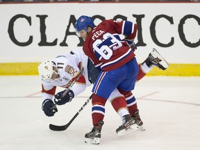 Matthew Peca hits Jonathan Huberdeau pf the Florida Panthers in second period of preseason action in Bathurst, N.B. on Wednesday, Sept. 18, 2019.