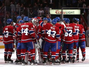 Canadiens players celebrate after 5-4 shootout win over the Florida Panthers in NHL pre-season action at the Bell Centre in Montreal on Sept. 19, 2019.