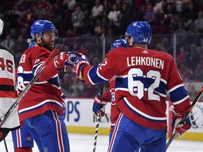 Canadiens' Artturi Lehkonen celebrates with defenceman Shea Weber after scoring a goal against the New Jersey Devils at the Bell Centre on Sept. 16, 2019.