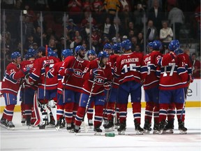 Canadiens players celebrate after Nick Suzuki scored winning goal in overtime for 4-3 victory over the Ottawa Senators in NHL pre-season action at the Bell Centre in Montreal on Sept. 28, 2019.