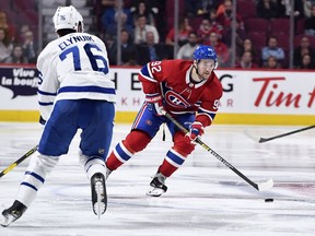 Montreal Canadiens forward Jonathan Drouin skates with the puck as Toronto Maple Leafs forward Hudson Elynuik defends during the third period at the Bell Centre on Sept. 23, 2019.