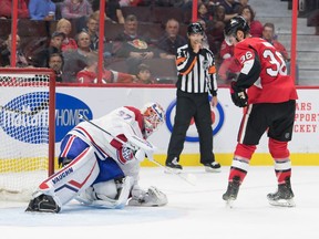 Montreal Canadiens goalie Keith Kinkaid makes a save in front of Senators centre Colin White at the Canadian Tire Centre in Ottawa on Saturday, Sept. 21, 2019.