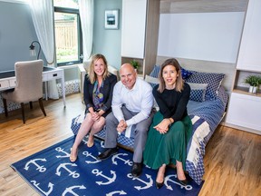 (Left to right) Kathleen Howard and Frederick Le Pailleur with TELUS Future Friendly Home in Montreal, and Stephanie Dionne, administration services director at The Lighthouse, in the centre’s newly renovated parents’ room.