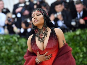 In this file photo taken on May 07, 2018, Rapper Nicki Minaj arrives for the 2018 Met Gala at the Metropolitan Museum of Art in New York.  On Sept. 5, 2019, Minaj surprised fans by announcing her retirement from rap, saying she is going to focus on family.