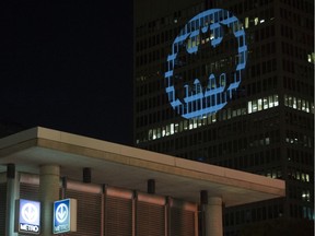 The Batman signal is projected onto a building to celebrate Batman Day in Montreal, Saturday, September 21, 2019.