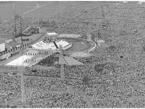 In this photo from Sept. 12, 1984, Pope John Paul II welcomes 350,000 people to celebrate mass with him at Jarry Park.