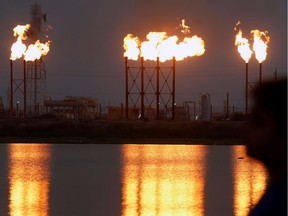 Flames emerge from flare stacks at Nahr Bin Umar oil field, north of Basra, Iraq September 16, 2019.