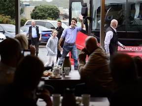 Liberal Leader Justin Trudeau and his daughter Ella Grace make a whistle stop in Mascouche on Saturday, Sept. 14, 2019. Trudeau is spending his Saturday making whistle stops in rural Quebec, but while he may prefer to keep the conversations light, some Quebec residents forced conversations about his stance on the province's controversial secularism law.