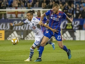 Montreal Impact forward Maximiliano Urruti (37) and FC Cincinnati defender Maikel van der Werff (23) battle for the ball during the first half at Saputo Stadium on Saturday, Sept. 14, 2019.