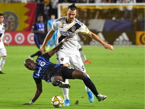 Montreal Impact defender Rod Fanni (16) battles Los Angeles Galaxy forward Zlatan Ibrahimovic at StubHub Center in Carson, Calif., on Sept. 21, 2019.