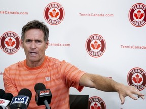 Sylvain Bruneau, coach of Canadian tennis star Bianca Andreescu, responds to a question during a news conference in Montreal on Tuesday, Sept. 10, 2019.