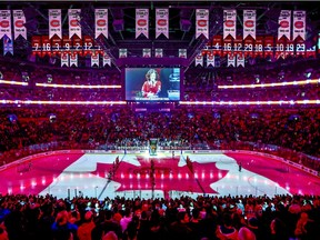 The Canadian flag is projected onto the ice at the Bell Centre in Montreal during the singing of the national anthem before NHL game between the Canadiens and Florida Panthers on Jan. 15, 2019.