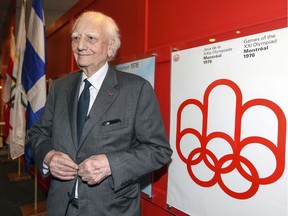 Olympic Stadium architect Roger Taillibert has his photo taken next to Montreal Olympics posters during event at the stadium opening a series of exhibits celebrating the 40th anniversary of the 1976 Olympic Games, in Montreal Monday June 6, 2016. (John Mahoney} / MONTREAL GAZETTE) ORG XMIT: 56363 - 0000
