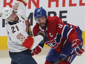 Canadiens' Shea Weber, left, holds back Panthers' Vincent Trocheck during pre-season action. The Habs plan to have Weber et up at the left faceoff circle during power plays to take advantage of his powerful shot.