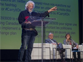 Stephen Lewis and Ellen Gabriel listen to David Suzuki as he delivers his talk at the Rialto Theatre on Tuesday night.