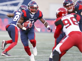 Montreal Alouettes running-back William Stanback carries the ball against the Calgary Stampeders in Montreal on Oct. 5, 2019.