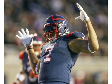 Alouettes defensive end John Bowman celebrates after sacking Calgary Stampeders quarterback Bo Levi Mitchell in Montreal on Saturday, Oct. 5, 2019.