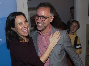 Luc Rabouin, Projet Montréal's candidate in a by-election for borough mayor in Plateau-Mont-Royal, is congratulated by Montreal mayor Valérie Plante after his victory in  Montreal Sunday, Oct. 6, 2019. Rabouin's son Alexis stands behind him at right.