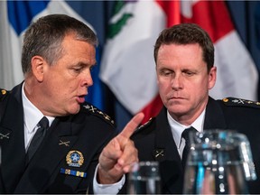 Montreal police Chief Sylvain Caron, left, and Marc Charbonneau, chief inspector of the Corporate Service Division of the Montreal police service, spoke Monday about plans to tackle racial profiling within the Montreal police force.