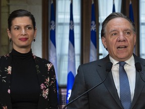Quebec Premier François Legault called the report on the SPVM's findings "unacceptable" and provincial Public Security Minister Geneviève Guilbault announced Quebec’s provincial police academy will hold a seminar on racial and social profiling. Both are shown in a file photo here.