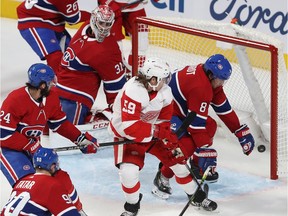 Montreal Canadiens goaltender Carey Price looks back as Detroit Red Wings left wing Tyler Bertuzzi (59) scores in front of Montreal Canadiens' Ben Chiarot (8) with Phillip Danault (24) and Tomas Tatar (90) looking on, during first period in Montreal on Thursday, Oct. 10, 2019.