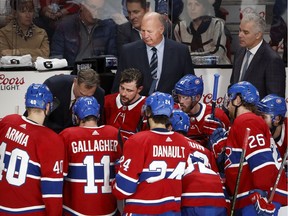 Canadiens head coach Claude Julien listens in on bench discussion during timeout during NHL game against the Tampa Bay Lightning at the Bell centre in Montreal on Oct. 15, 2019.