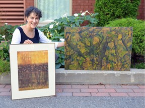 Ellen Shizgal, pictured, with two of her late mother Buddy Abrams Shizgal's paintings.