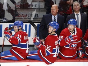 Montreal Canadiens head coach Claude Julien watches the Habs open the scoring against the Tampa Bay Lightning as right wing Brendan Gallagher, from left, center Jesperi Kotkaniemi and left wing Artturi Lehkonen look on in Montreal on Tuesday, Oct.15, 2019.