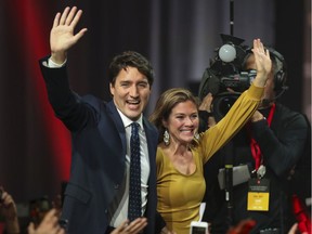 Justin Trudeau and his wife Sophie Grégoire arrive onstage for his victory speech at Liberal election headquarters at the Palais des congrès in Montreal on Tuesday October 22, 2019.