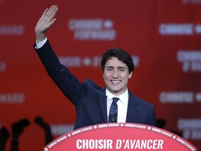 Justin Trudeau waves to supporters at Liberal election headquarters at the Palais des Congrès in Montreal Tuesday October 22, 2019. (John Mahoney / MONTREAL GAZETTE) ORG XMIT: 63325 - 9100