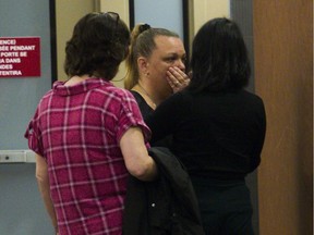 Vanessa Higgins is comforted after delivering her victim impact statement at the Montreal courthouse.
