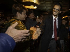 Sameer Zuberi, MP elect for Pierrefonds-Dollard, greets supporters as he enters his victory party on election night, Oct. 21.