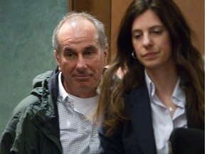 Ronald Weinberg, left, walks out of courtroom on May 12, 2014 with his lawyer, Annie Emond.