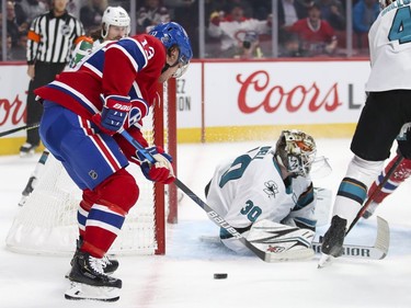 Montreal Canadiens Max Domi can't control the puck next to San Jose Sharks goalie Aaron Dell's net during first period of National Hockey League game in Montreal Thursday October 24, 2019.