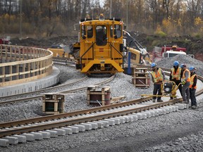 Work crews assemble new rail Iines for the Brossard REM station on Thursday, Oct. 24, 2019.
