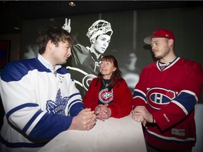 Gail Woodman is flanked by her two sons Matt, right, and Justin in the Director's Lounge at the Belll Centre as they wait to watch the Montreal Canadiens play the Toronto Maple Leafs on Saturday, Oct. 26, 2019.